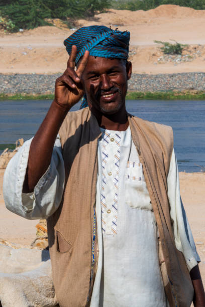 Jewel of Saudi Arabia: Jeddah, 'Jeddah River', 08 March 2021 Jeddah, Saudi Arabia, March 08, 2021: The river is located in Al-Khurma Valley (Sanabil district) 40 km South of Jeddah. This beautiful river in Jeddah is actually a torrent stream nevertheless locals called it "Jeddah River". Though floods are coming from the valleys during the rain season and pouring via this stream into the Red Sea, the water flows here throughout alll seasons and one can find fish all year round.
As the river is surrounded lots of bushes, quite some exotic birds find their habitat here. The herdsman brings his camels to cool their feet and let them eat the fresh grass at the river’s shores while he takes a rest in the shadow of a tree.
This picturesque natural environment is a good place to enjoy a picnic and to take a dip in the fresh water. saudi arabia jeddah landscape stock pictures, royalty-free photos & images