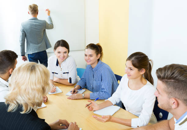 istock positive students working together in auditorium 1317505052