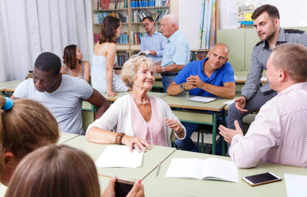 istock Men and women discussion during course 1317505478