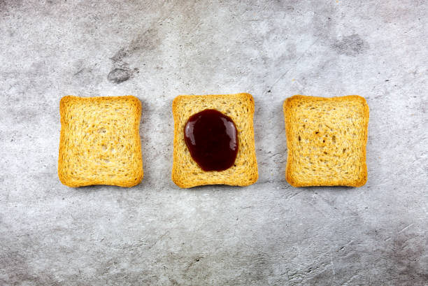 istock three rusks slices lined up one of which is different because with jam 1317506063