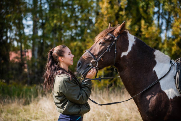 istock Tender communication between a rider and her horse before a riding lesson 1317514238