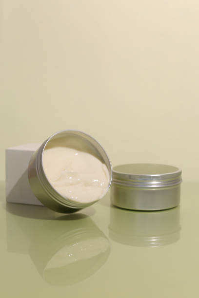 istock Aluminum cosmetic jar on green background 1317514569
