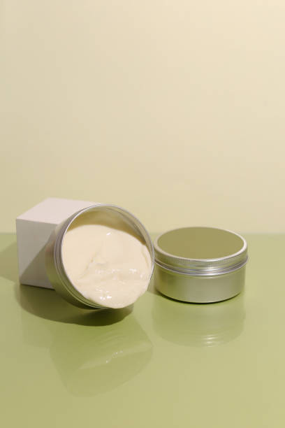 istock Aluminum cosmetic jar on green background 1317514592