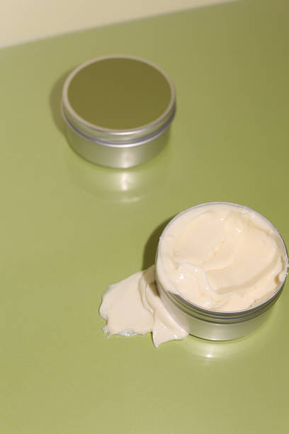istock Aluminum cosmetic jar on green background 1317514721