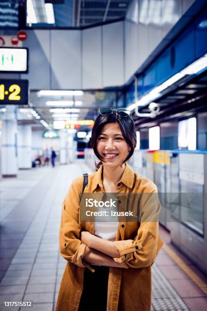 Happy Young Woman At Subway Platform Stock Photo - Download Image Now - 20-24 Years, Adult, Adults Only