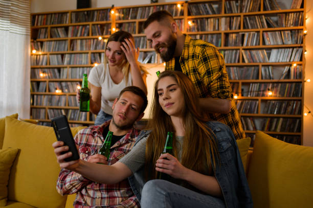 istock Friends drinking beer and taking selfie with smartphone 1317515894