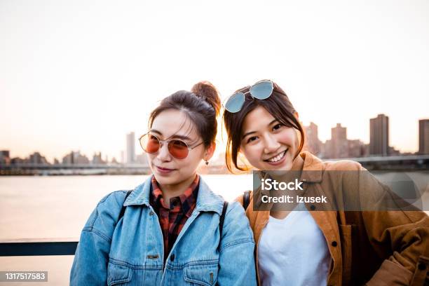 Young Female Friends On City Break Stock Photo - Download Image Now - 20-24 Years, Adult, Adults Only