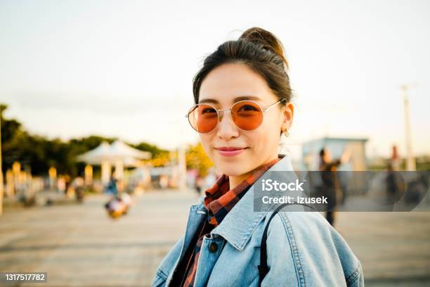 Smiling Woman On City Break During Weekend Stock Photo - Download Image Now - 20-24 Years, Adult, Adults Only
