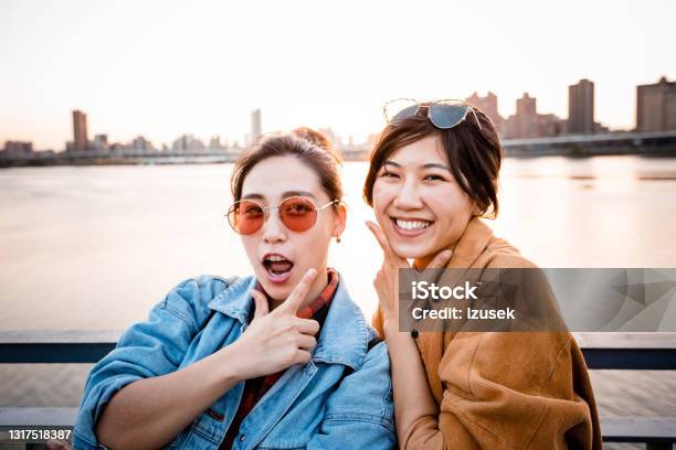 Happy Young Friends Enjoying City Break Stock Photo - Download Image Now - 20-24 Years, Adult, Adults Only