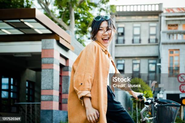 Cheerful Woman With Bicycle In City Stock Photo - Download Image Now - 20-24 Years, Adult, Adults Only