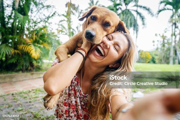 Young Woman Takes Selfie With Her Dog Stock Photo - Download Image Now - Dog, Women, Pets