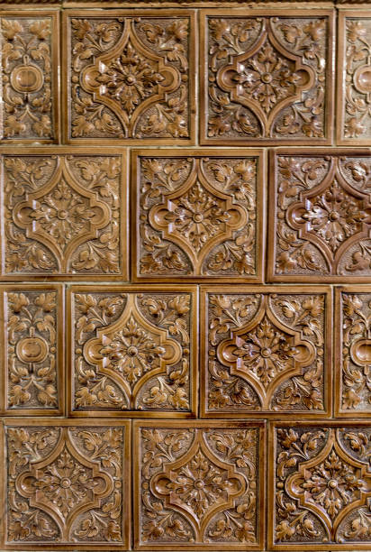 istock texture, backgrounds brown ceramic tiles on a stove for heating. Close-up texture of authentic tiled stove for background. 1317525316