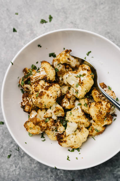 Overhead photo of golden fried cauliflower with parsely