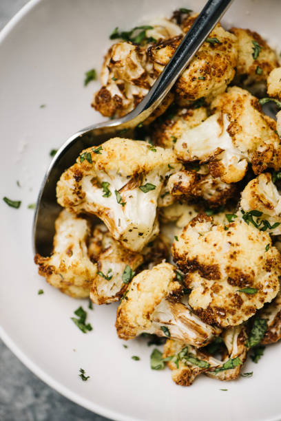 Golden fried cauliflower bowl with spoon