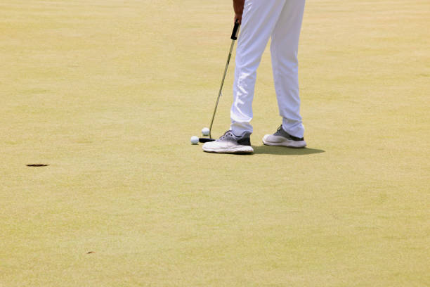 istock Low section of a young boy playing golf 1317526436