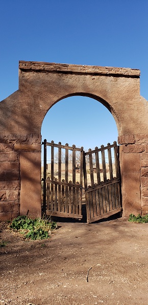 Photograph: Rustic wooden gates at the La Posada Hotel in Winslow, Arizona.