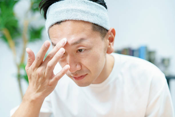 istock Men applying moisturizing cream to their face 1317528298