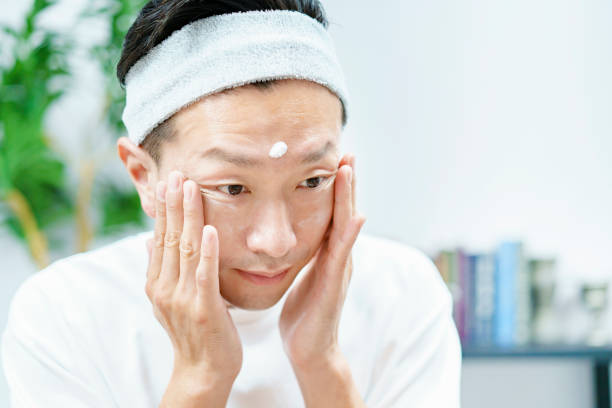 istock Men applying moisturizing cream to their face 1317528348