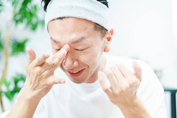 istock Men applying moisturizing cream to their face 1317528398