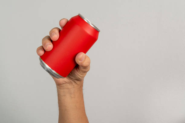 istock male hand holding a red can 1317529015