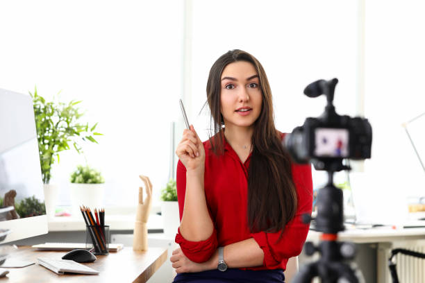 istock Young woman sitting in office opposite camera and presenting services 1317534197