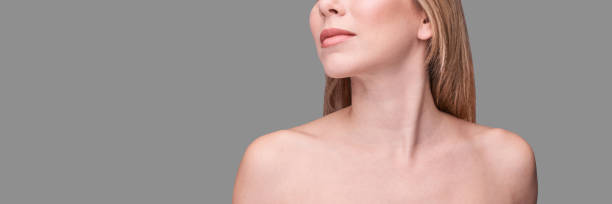 Cosmetology concept. Skin care product. Female portrait Cosmetology concept. Skin care product. Female portrait. Face mask. Home peeling. Grey background. Copyspace. Facial lifting treatment. Dermatology beauty model. Neck neck stock pictures, royalty-free photos & images