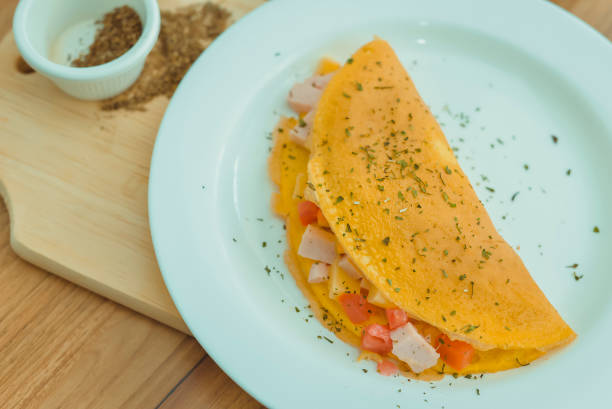 istock Crepes, thin pancakes with ham, cheese, and tomato 1317535319