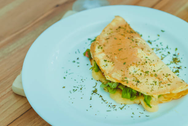 istock Crepes, thin pancakes with lettuce, oregano, and cheese 1317535346