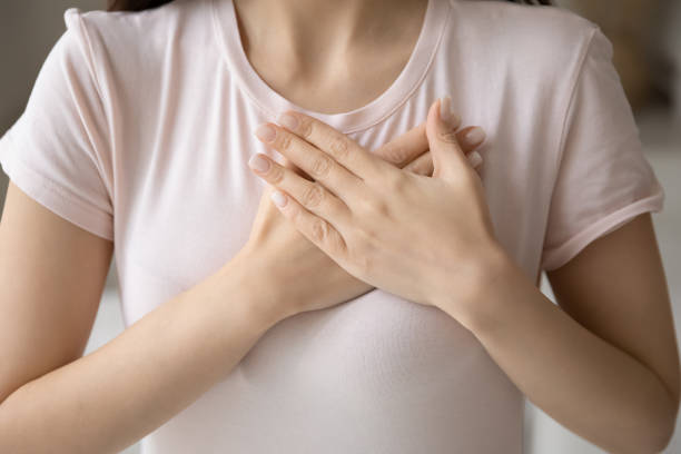 istock Grateful young woman applying hands on chest, expressing love 1317535596
