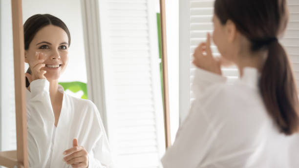 istock Happy young woman practicing skincare therapy procedures 1317535655