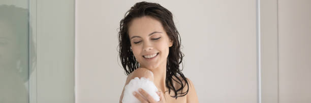 istock Happy girl enjoying morning bath routine, taking shower 1317535666