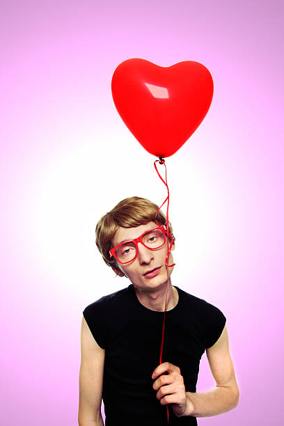 istock melancholic guy with heart balloon 131754046