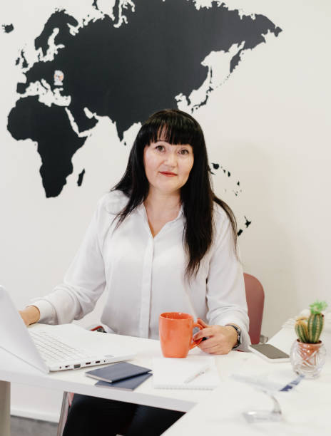 istock Confident travel agent using laptop in office for communication on-line 1317541858
