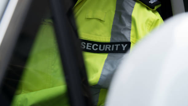 istock security guard waiting inside a security car while the seat belt is on. 1317545039