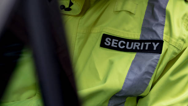istock security guard waiting inside a security car while the seat belt is on. 1317545043