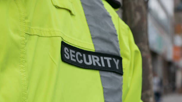 istock security guard waiting inside a security car while the seat belt is on. 1317545047
