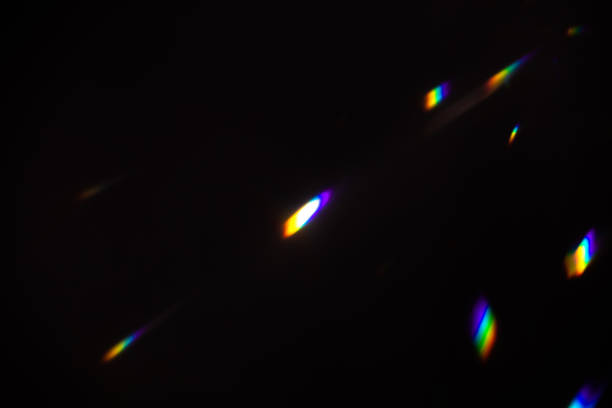 istock colorful warm rainbow crystal light leaks on black background 1317549521