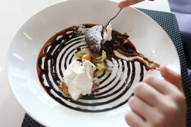 istock Person eating chocolate fondant 1317551078