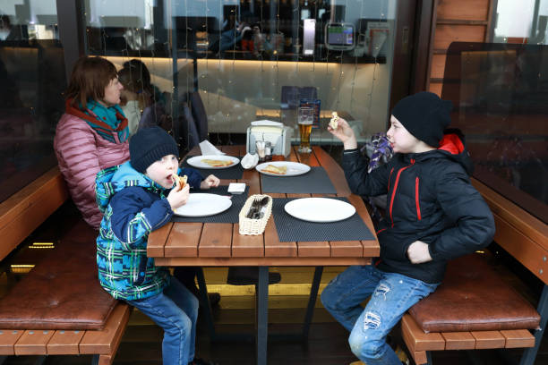 istock Two brothers eating pizza 1317551125