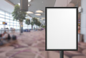 Blank advertising poster banner mockup in modern airport retail environment; large digital lightbox display screen. Billboard, poster, out-of-home OOH media display space..