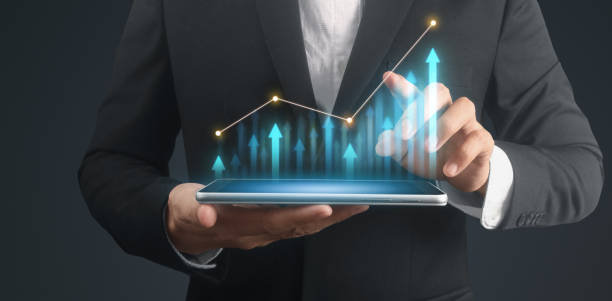 istock Businessman plan graph growth increase of chart positive indicators in his business,tablet in hand 1317553371