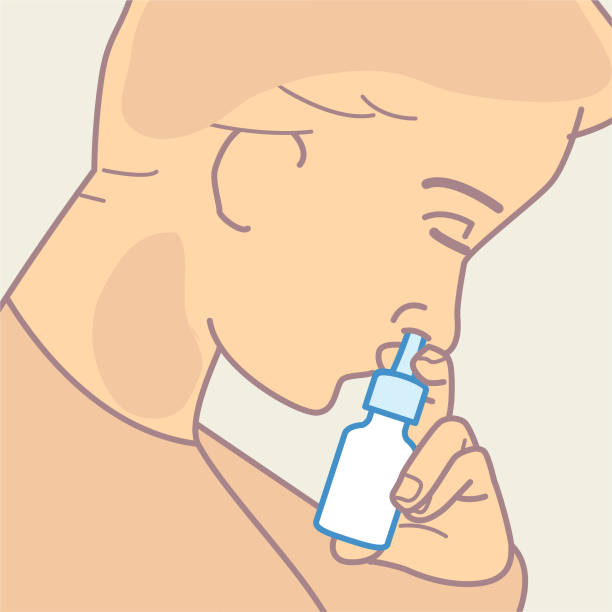 Inserting nasal spray into nostril Woman tilting head forward and inserting a nasal pump action spray relieved face stock illustrations