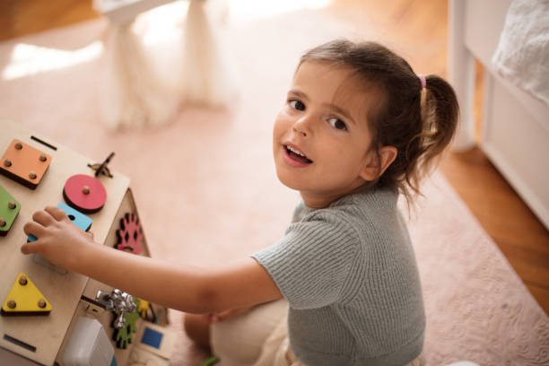 istock Toddler playing interactive games for good development at home. 1317554383