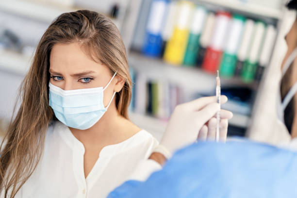 istock Woman having Vaccine Injection 1317554431