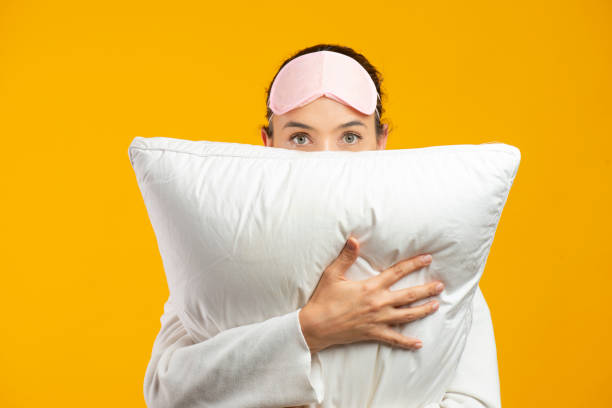 istock Woman Embracing Pillow 1317556384