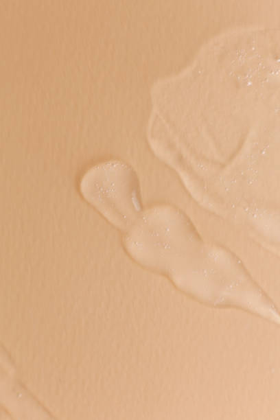 istock Cream gel transparent cosmetic sample texture isolated on beige background 1317557287