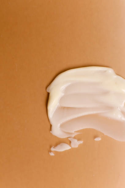 istock Cosmetic cream texture on neutral background 1317558940