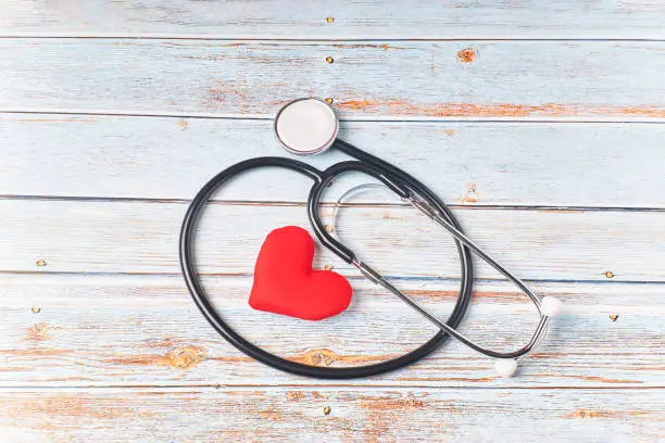 Photo of Stethoscope and red heart. Heart check. Health concept, health care. World heart day