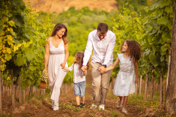 istock Family walking trough vineyard. 1317560241