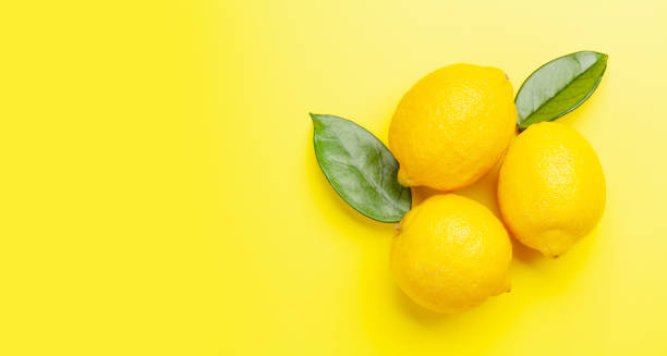 istock Fresh ripe lemon on yellow 1317560323